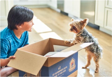 Child and Dog excited to receive their Hill's Products